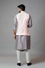 Powder pink Nehru jacket with geometric Mirrorwork embroidery paired with a slate grey drape kurta and pant pajama set
