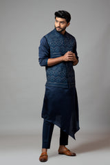 Navy Blue Kora Nehru jacket with Mughal inspired embroidery paired with a drape kurta set