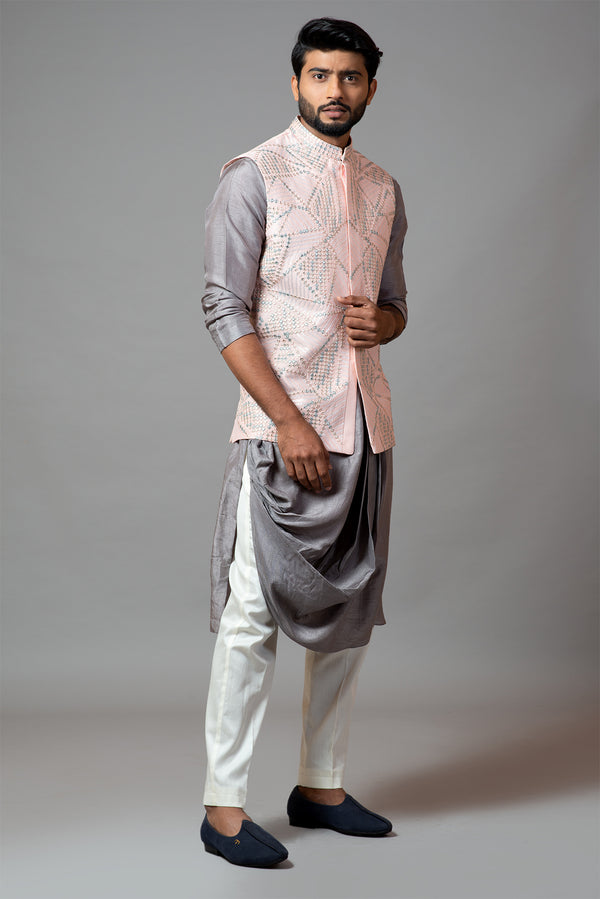 Powder pink Nehru jacket with geometric Mirrorwork embroidery paired with a slate grey drape kurta and pant pajama set
