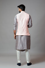 Powder pink Nehru jacket with geometric Mirrorwork embroidery paired with a slate grey drape kurta and pant pajama set